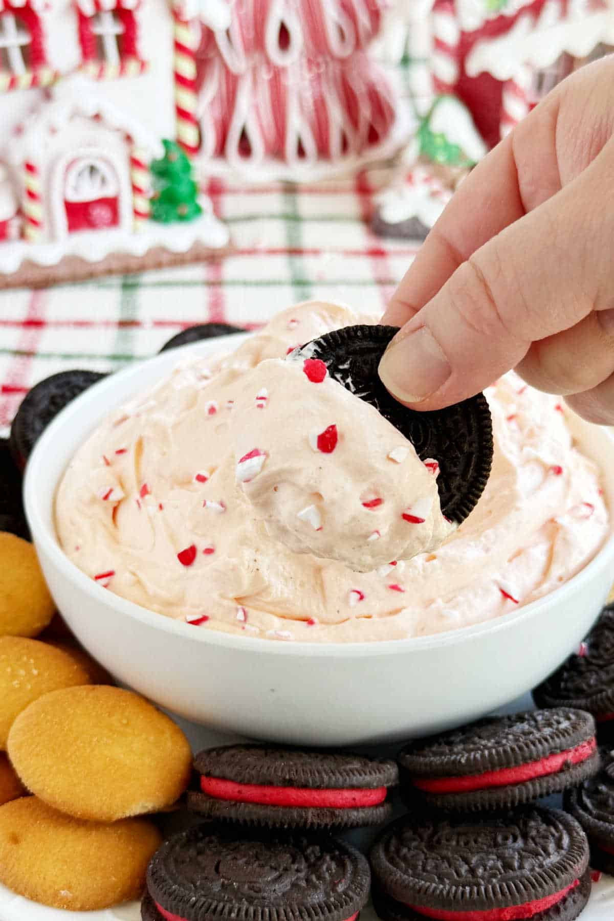 dip Oreo into candy cane dip.