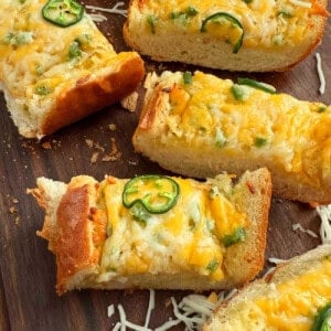 slices of cheesy garlic bread with jalapeno peppers.