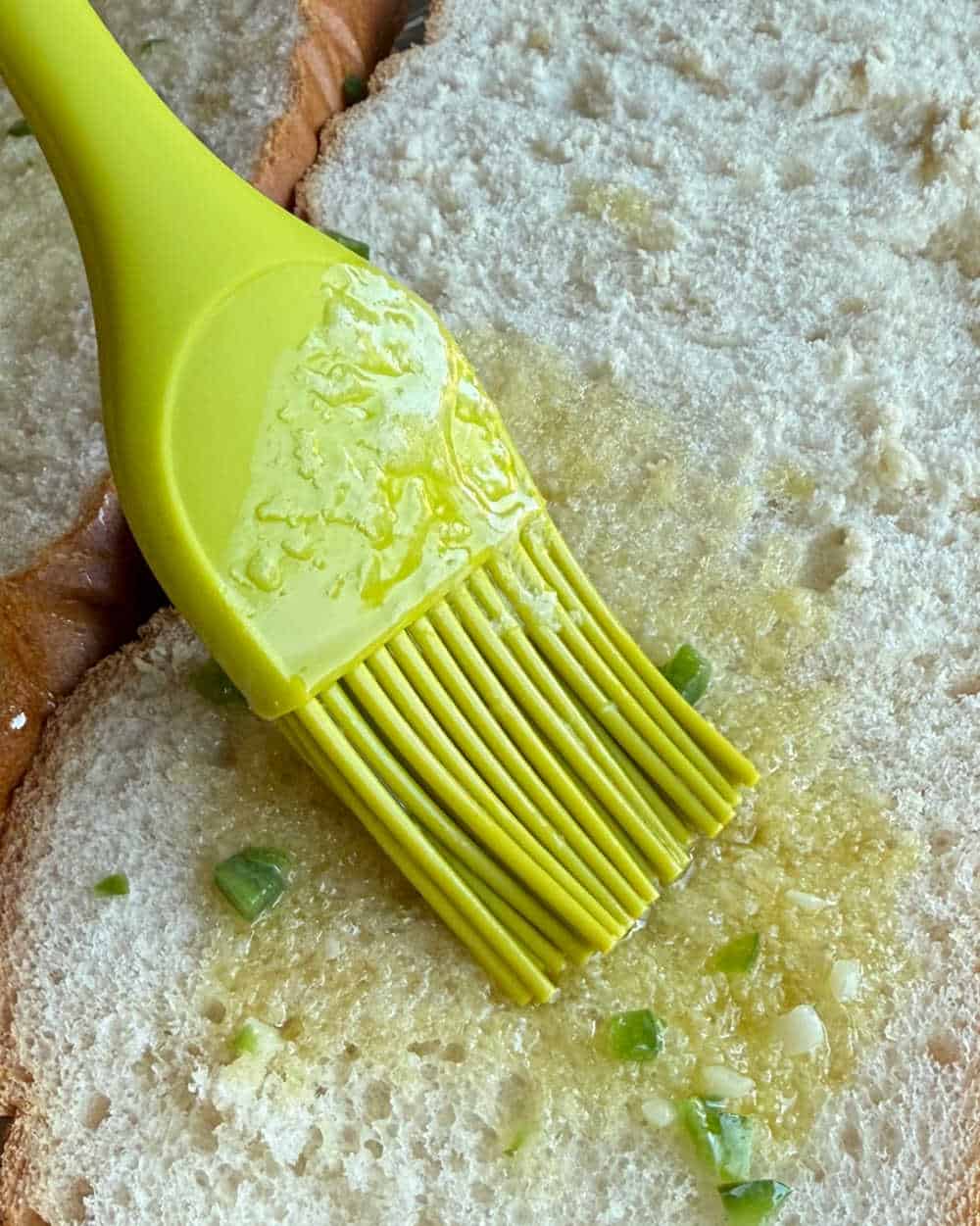 brush French bread with butter mixture.