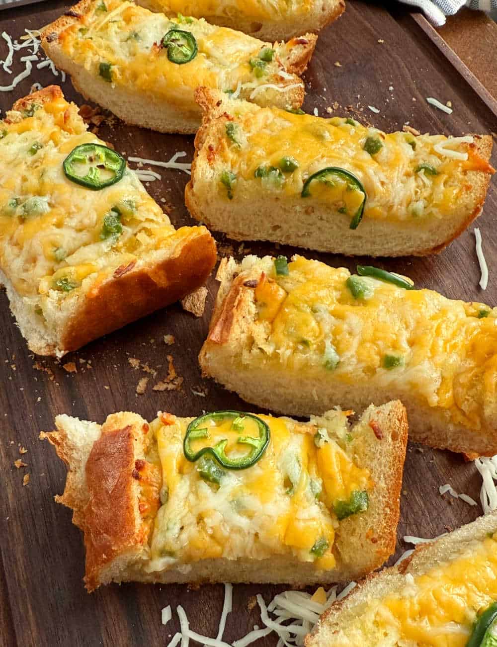 cheesy jalapeno garlic bread on cutting board