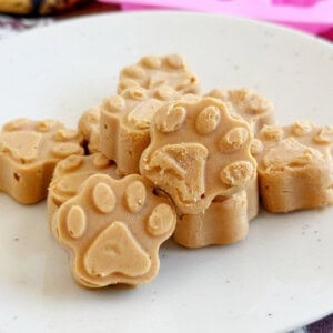 frozen peanut butter banana dog treats shaped like paw print.