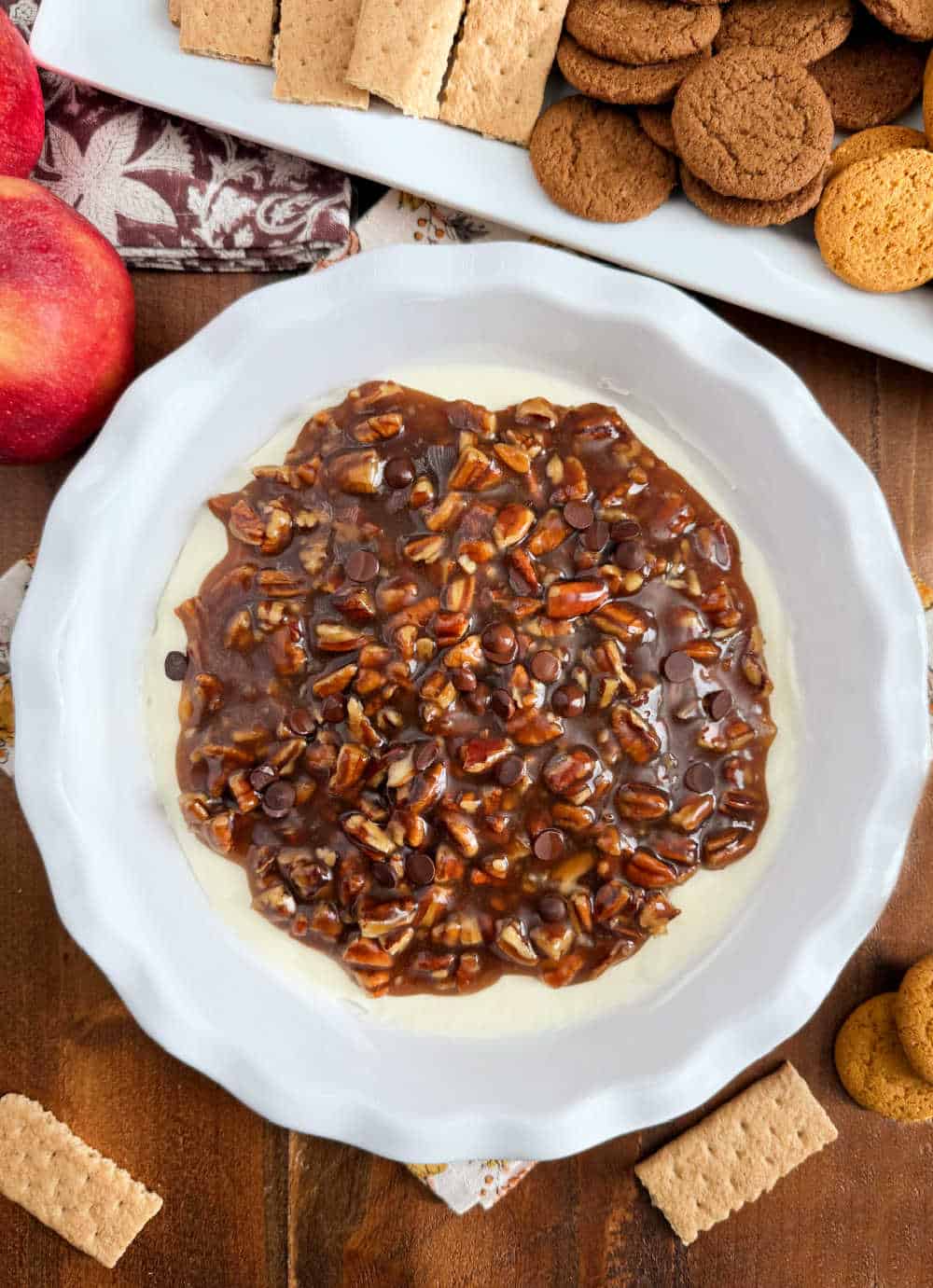 pecan pie dessert dip in pie dish on table.