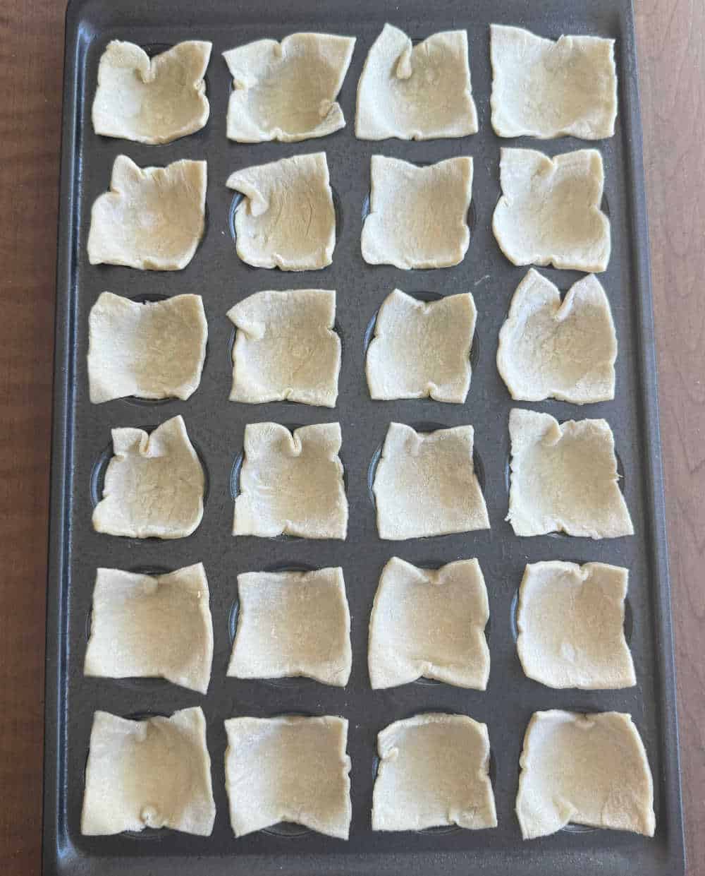 puff pastry in muffin tin.