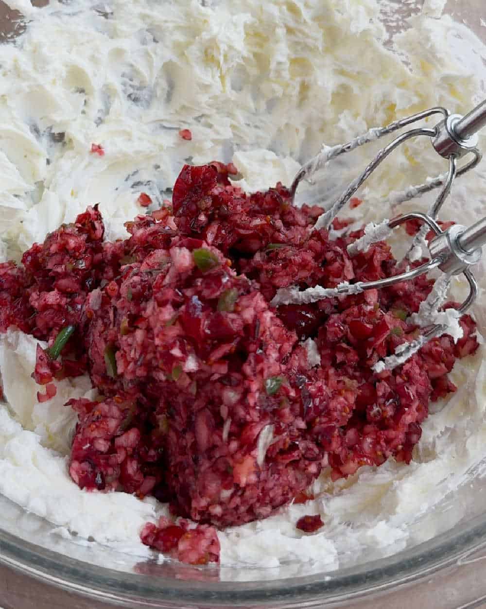 cranberry mixture and cream cheese in mixing bowl.