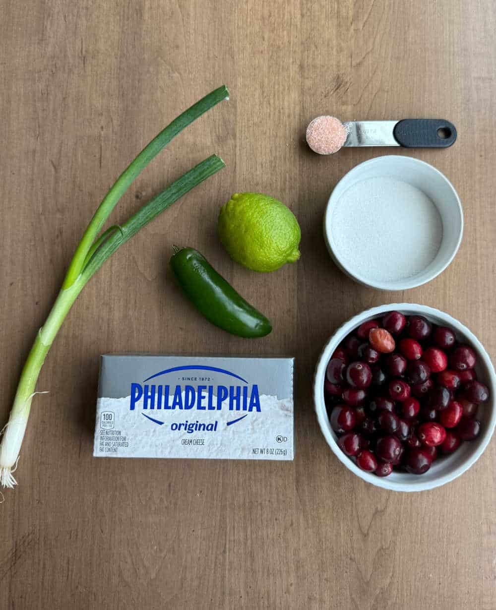 cream cheese, cranberries, jalapeno and ingredients to make dip.