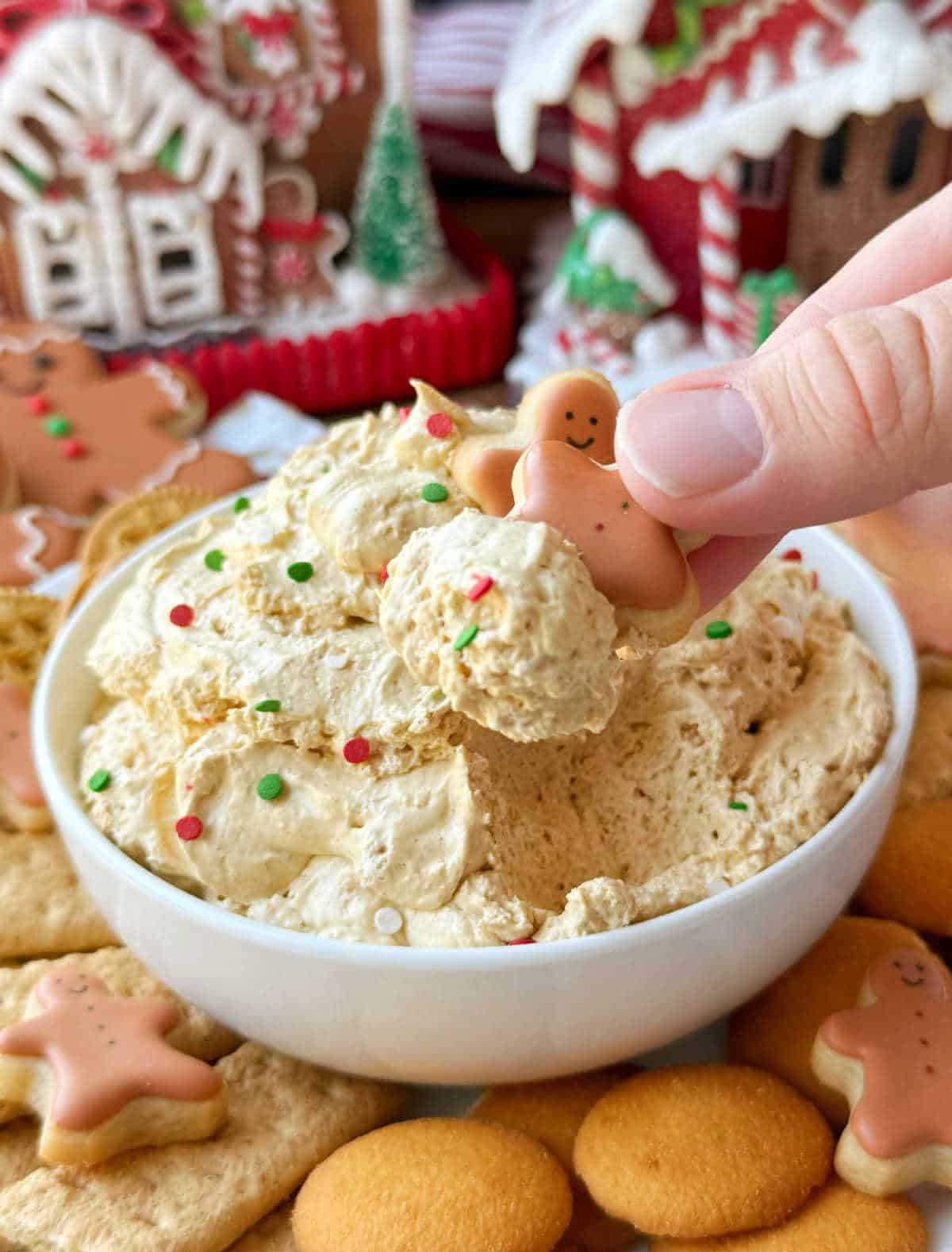 dip mini gingerbread man sugar cookies into dip