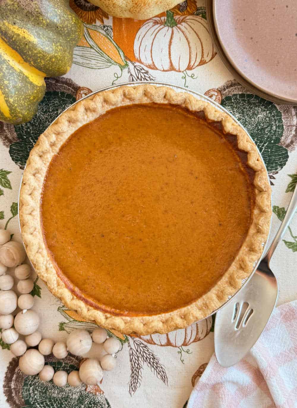 homemade pumpkin pie on thanksgiving table.