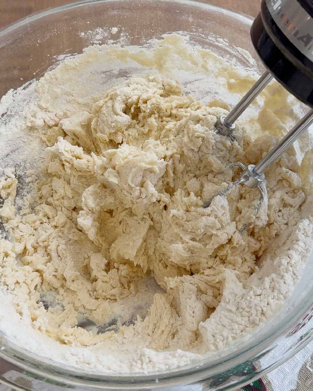 mix flour in dough with hand mixer.