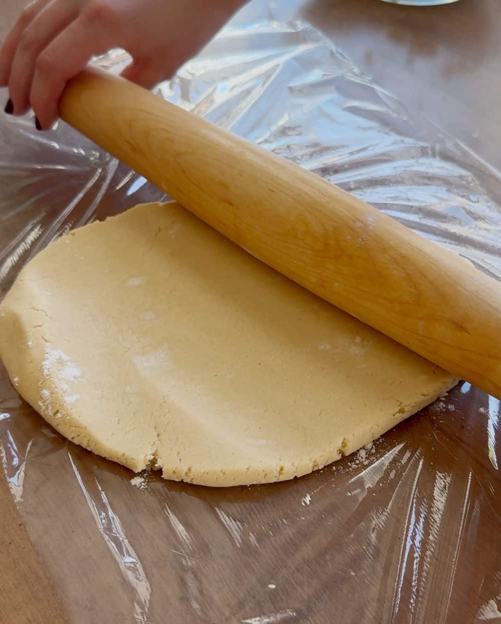 roll dough on plastic wrap.