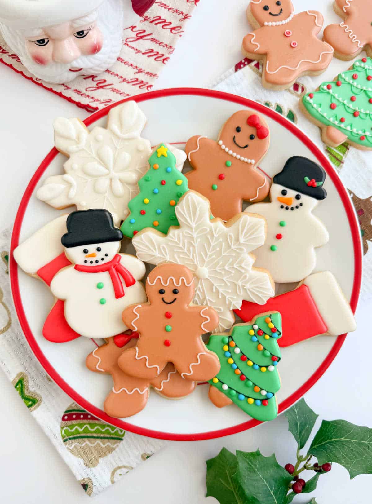 decorated Christmas cut out cookies on a plate.