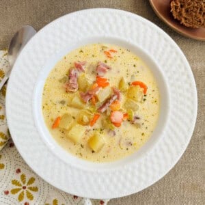 ham and potato soup in a white bowl.