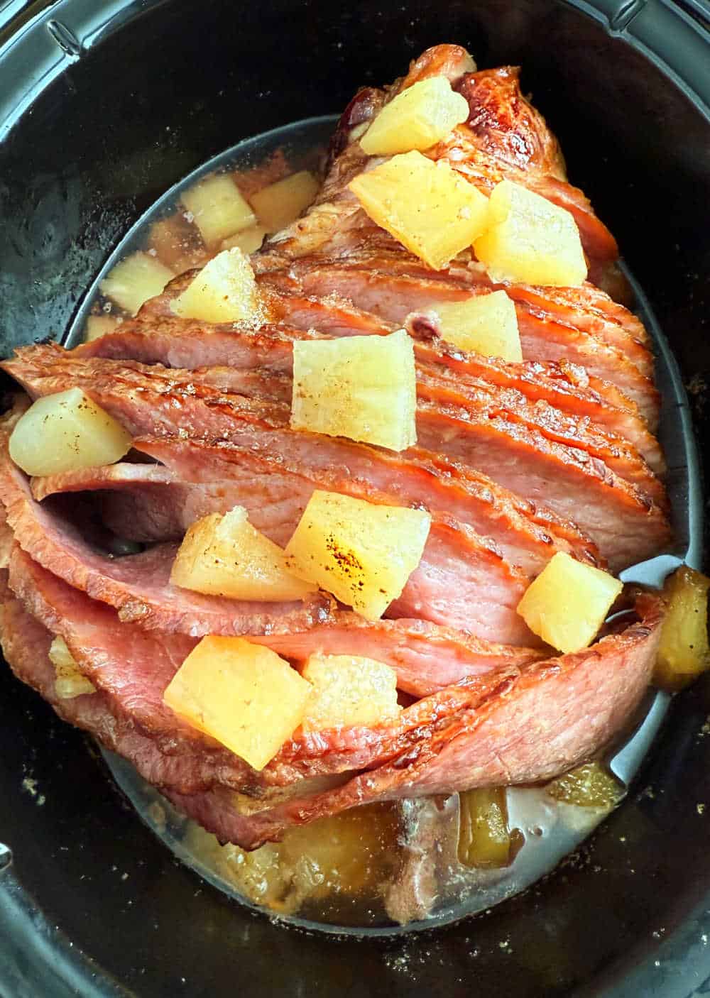 spiral cut ham in crock pot with pineapple.