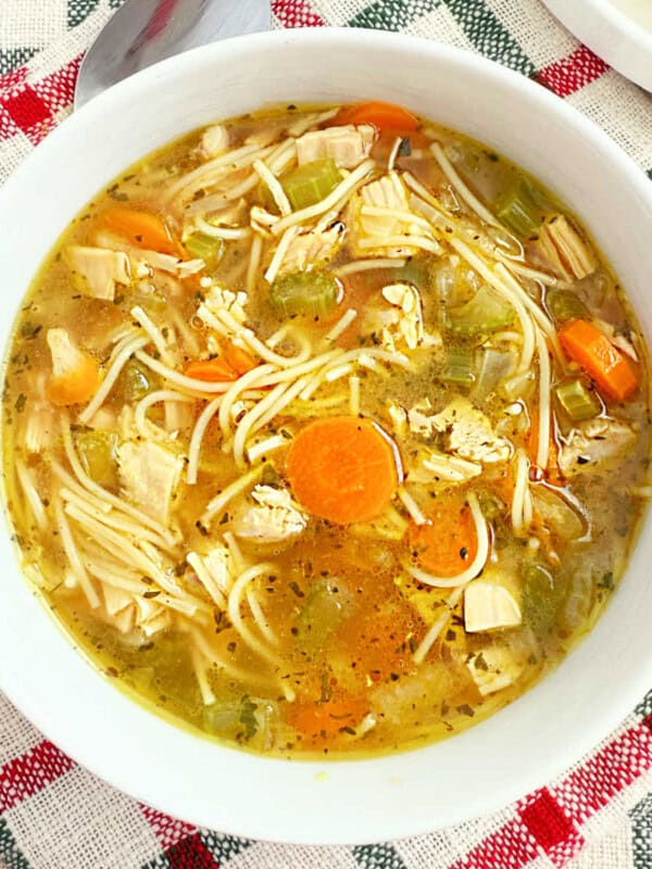 easy turkey soup with carrots, celery and noodles in bowl.