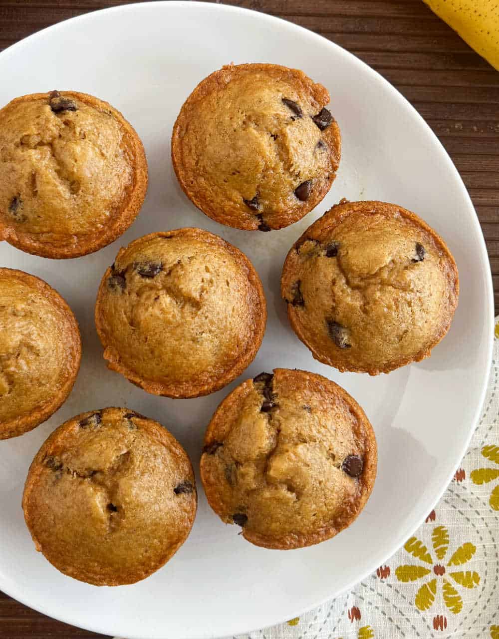 plate of banana applesauce muffins with chocolate chips.