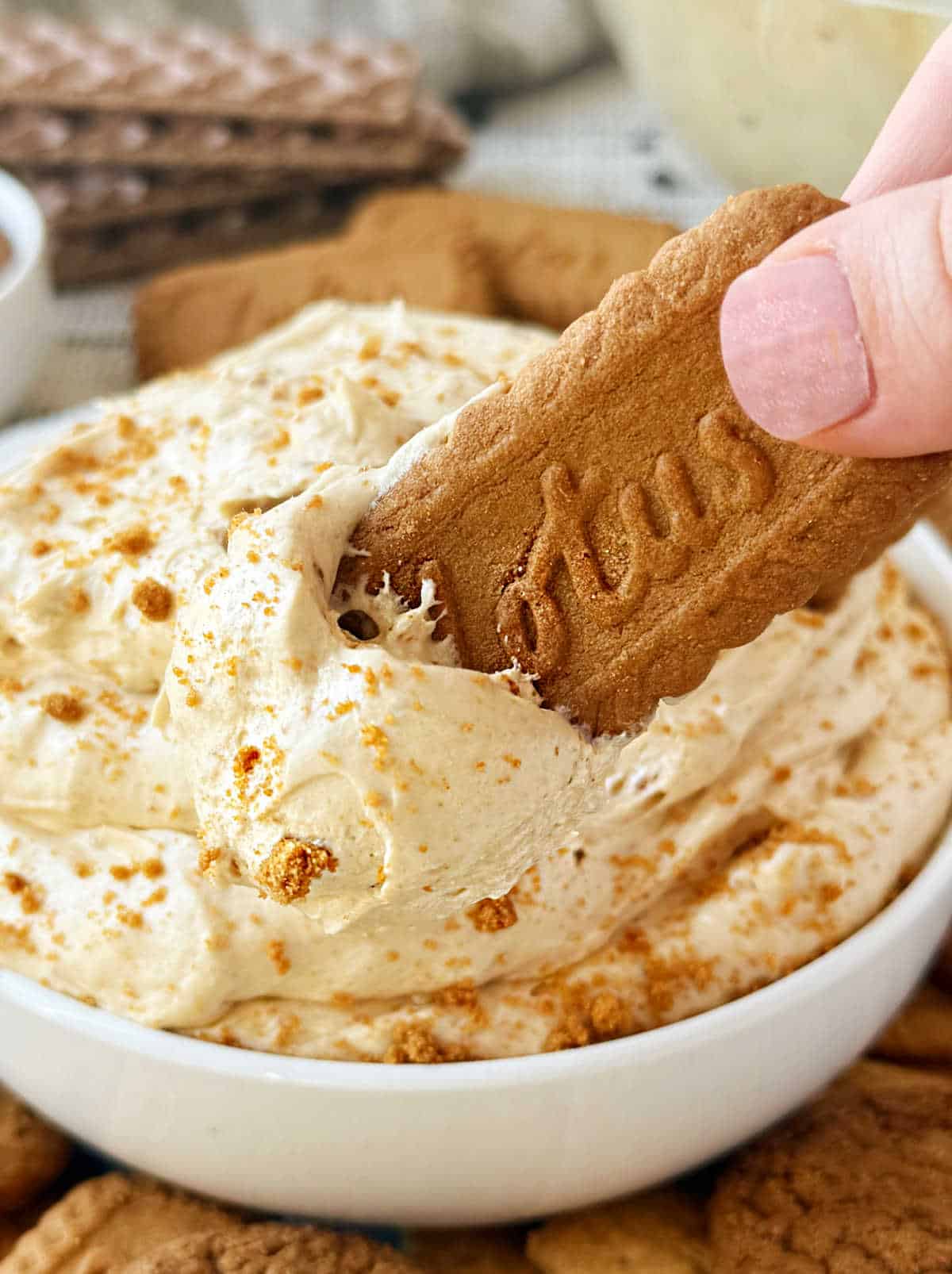 dip Biscoff cookie into cookie butter dip.