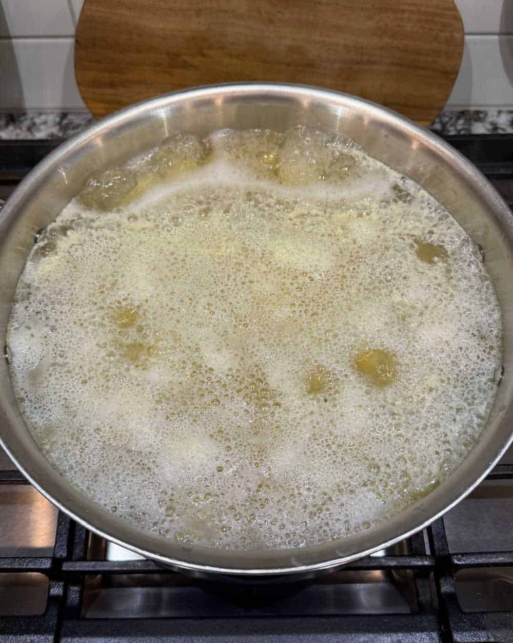 boiling potatoes on stove.