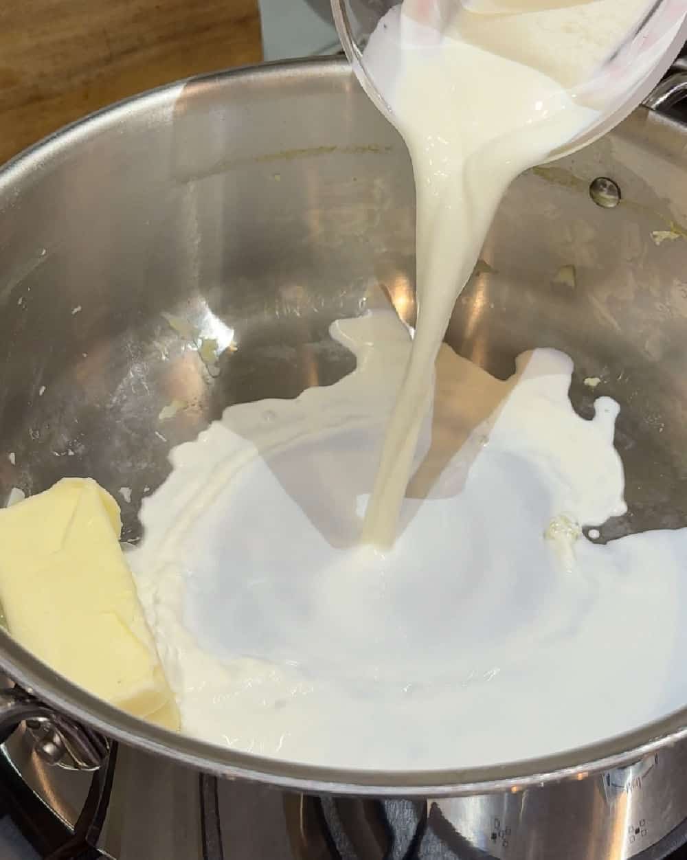 pour cream in large pot.