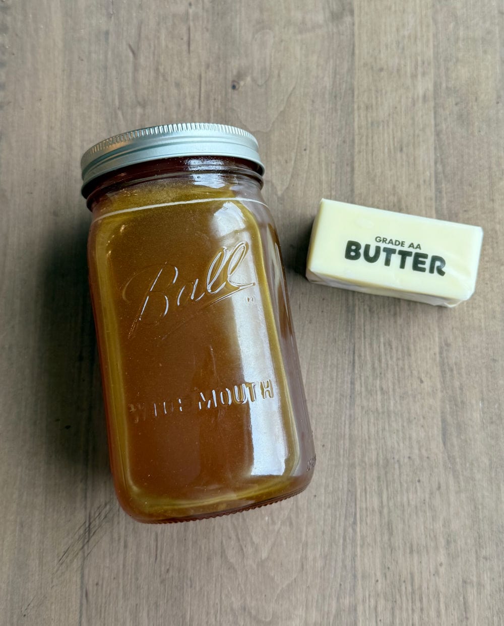 stick of butter and jar of raw honey.