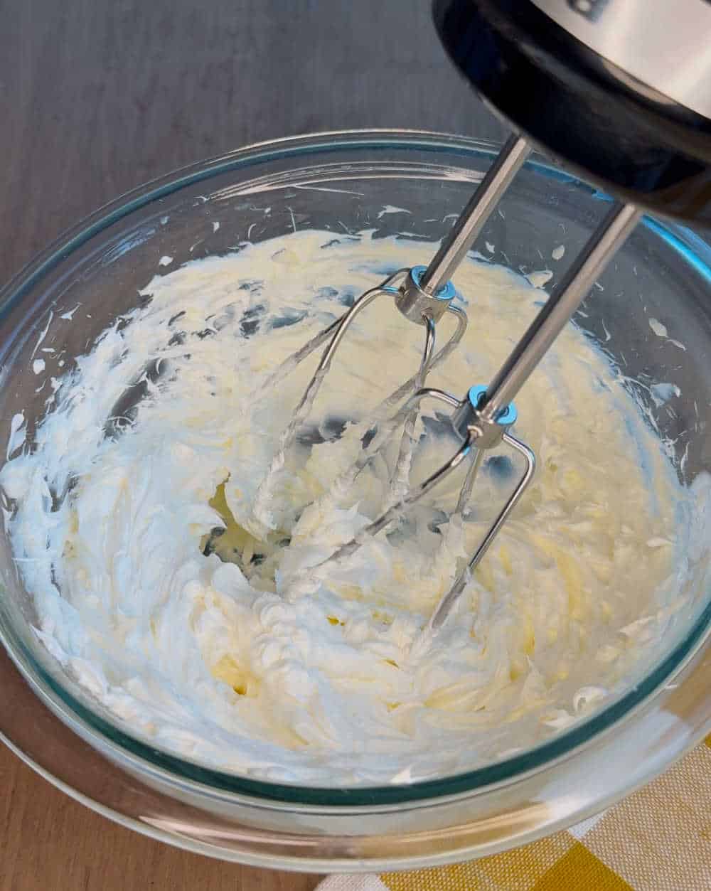 whip butter with electric mixer.