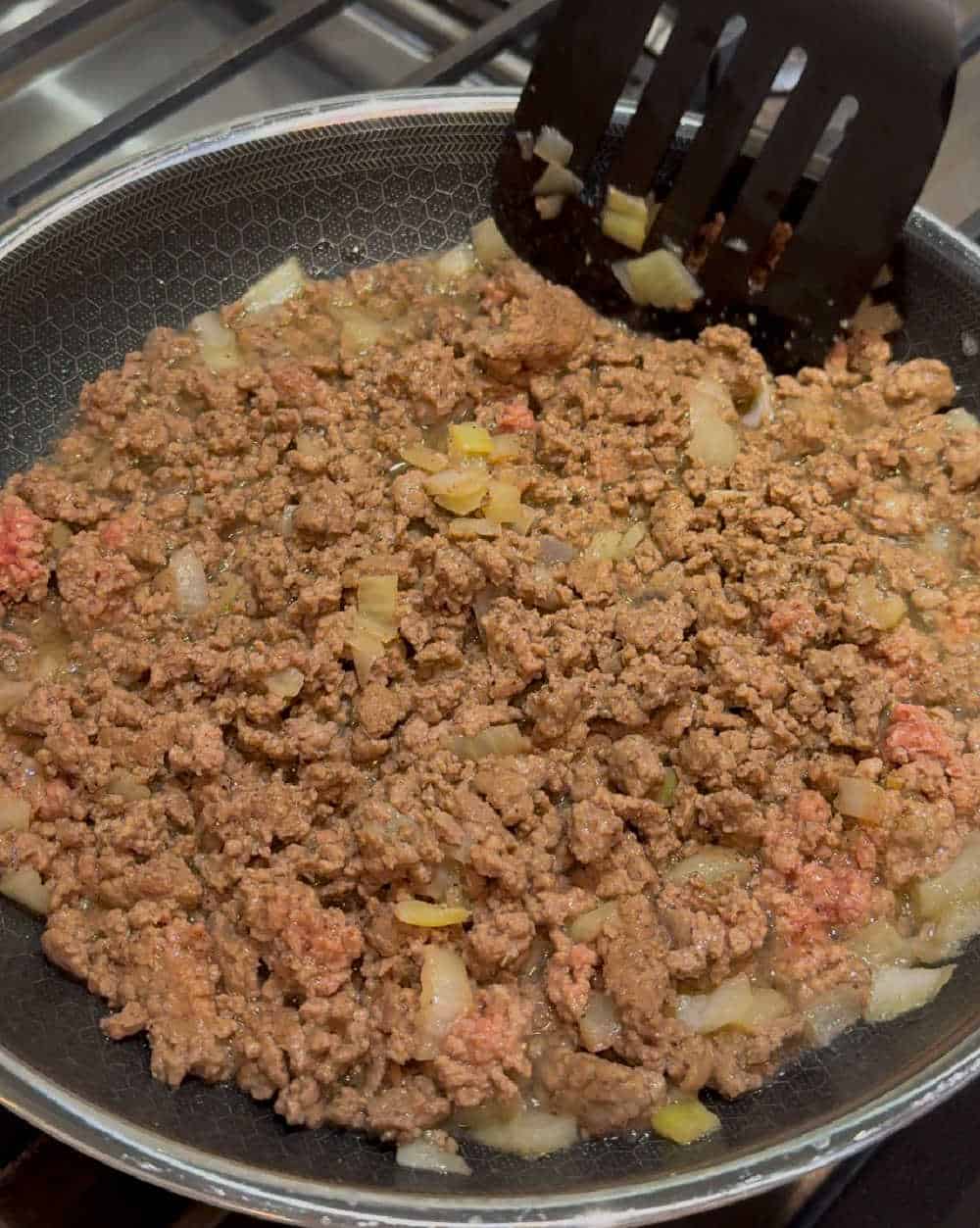 brown ground beef in skillet.