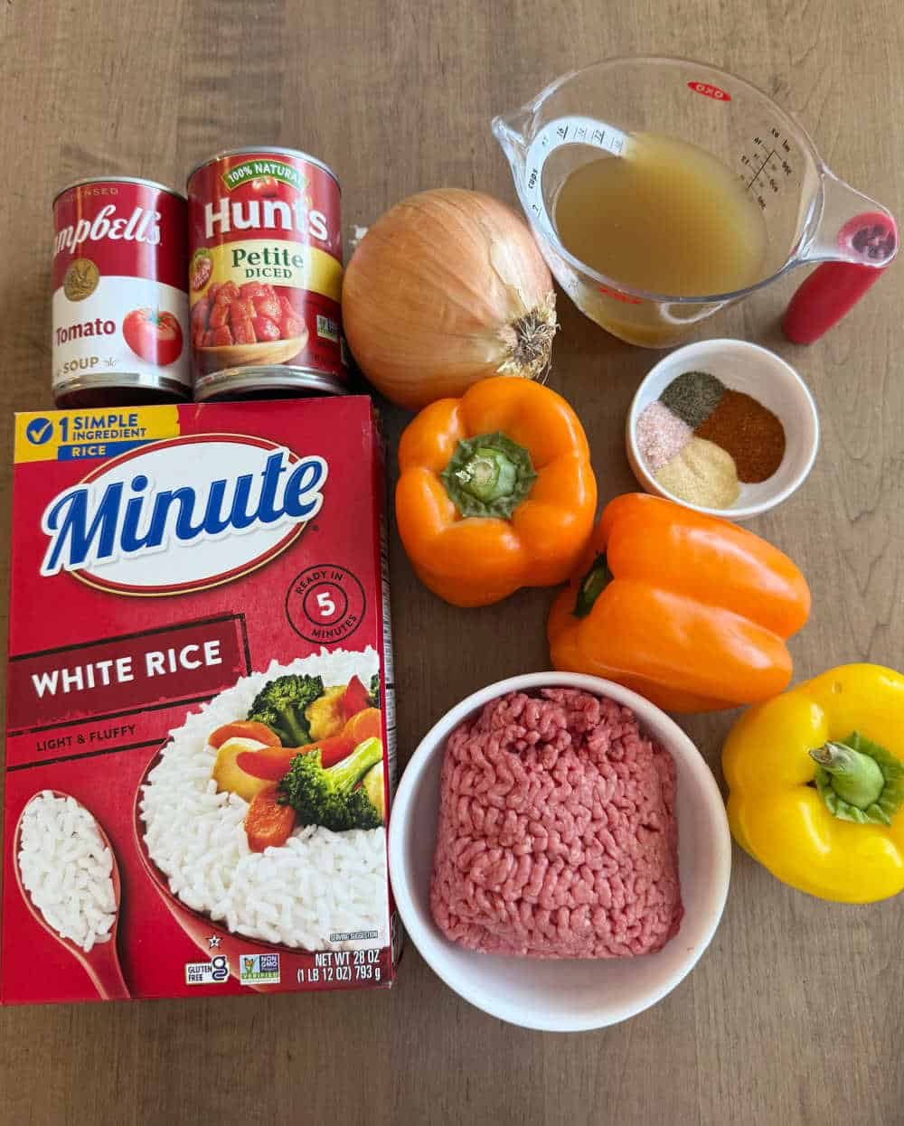 ground beef, minute rice, bell peppers and ingredients for recipe.