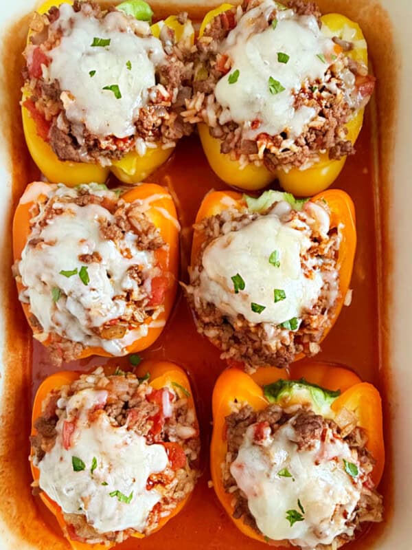 stuffed peppers baked in tomato sauce and topped with melted cheese.