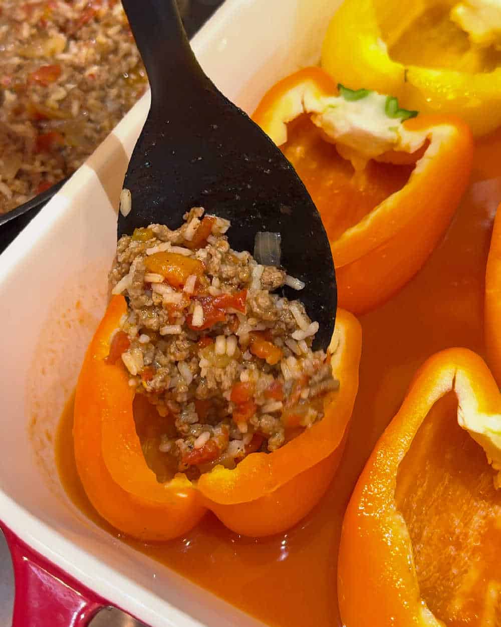 add filling to bell peppers.