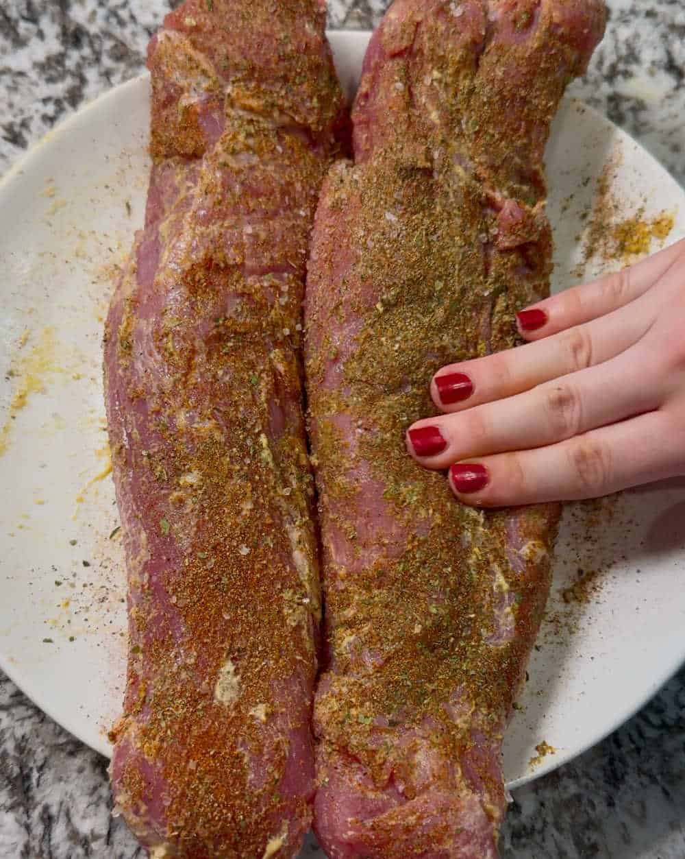 rub seasonings on meat.