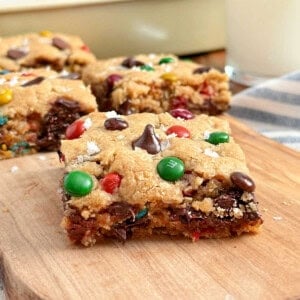 monster cookie bars with flaked salt and m&m candies.