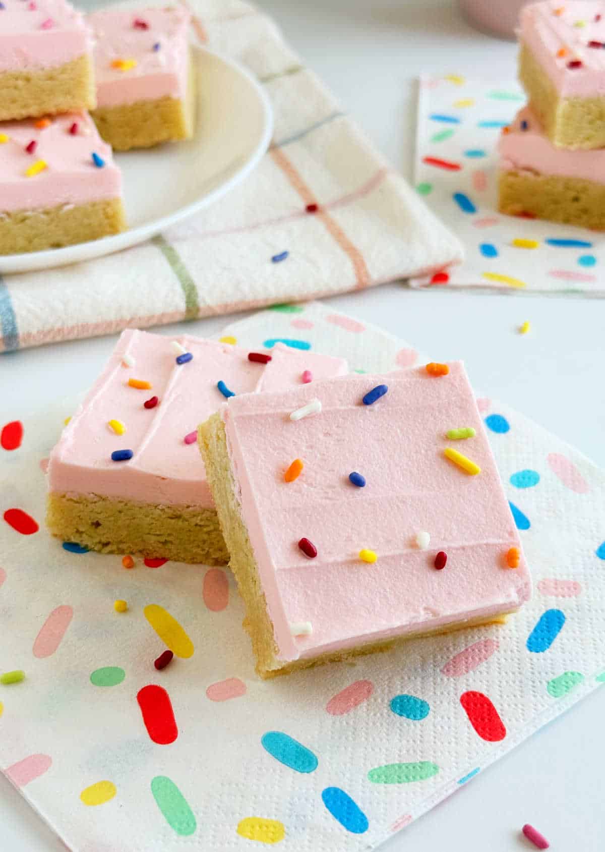 frosted sugar cookie bars with sprinkles.