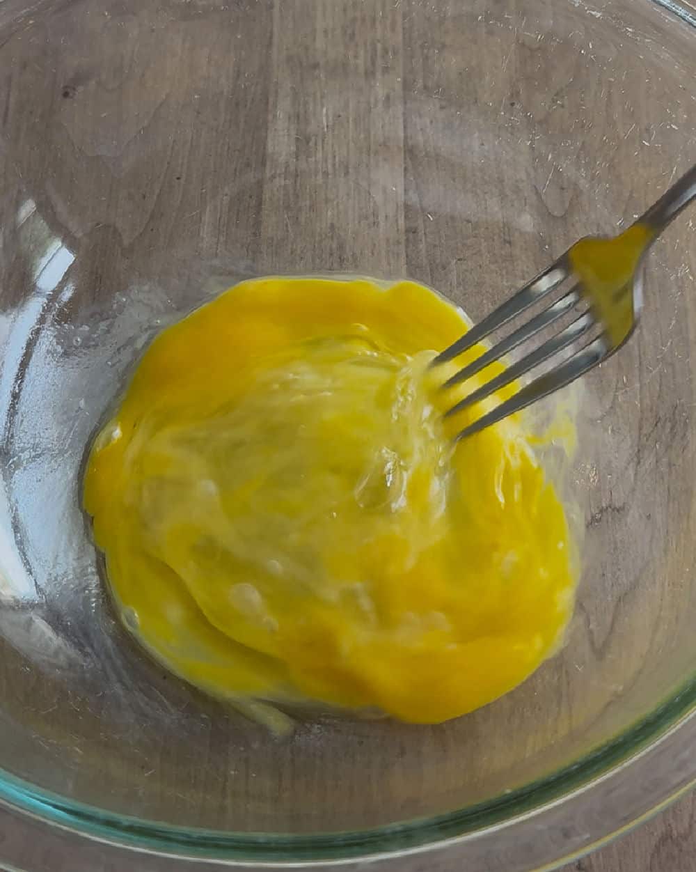 whisk eggs with fork.