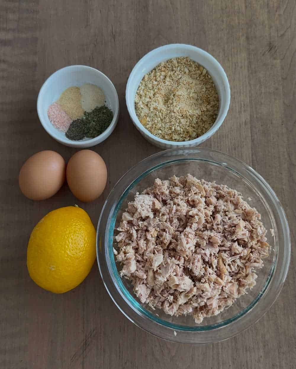 flaked tuna, eggs, cracker crumbs, lemon and spices.