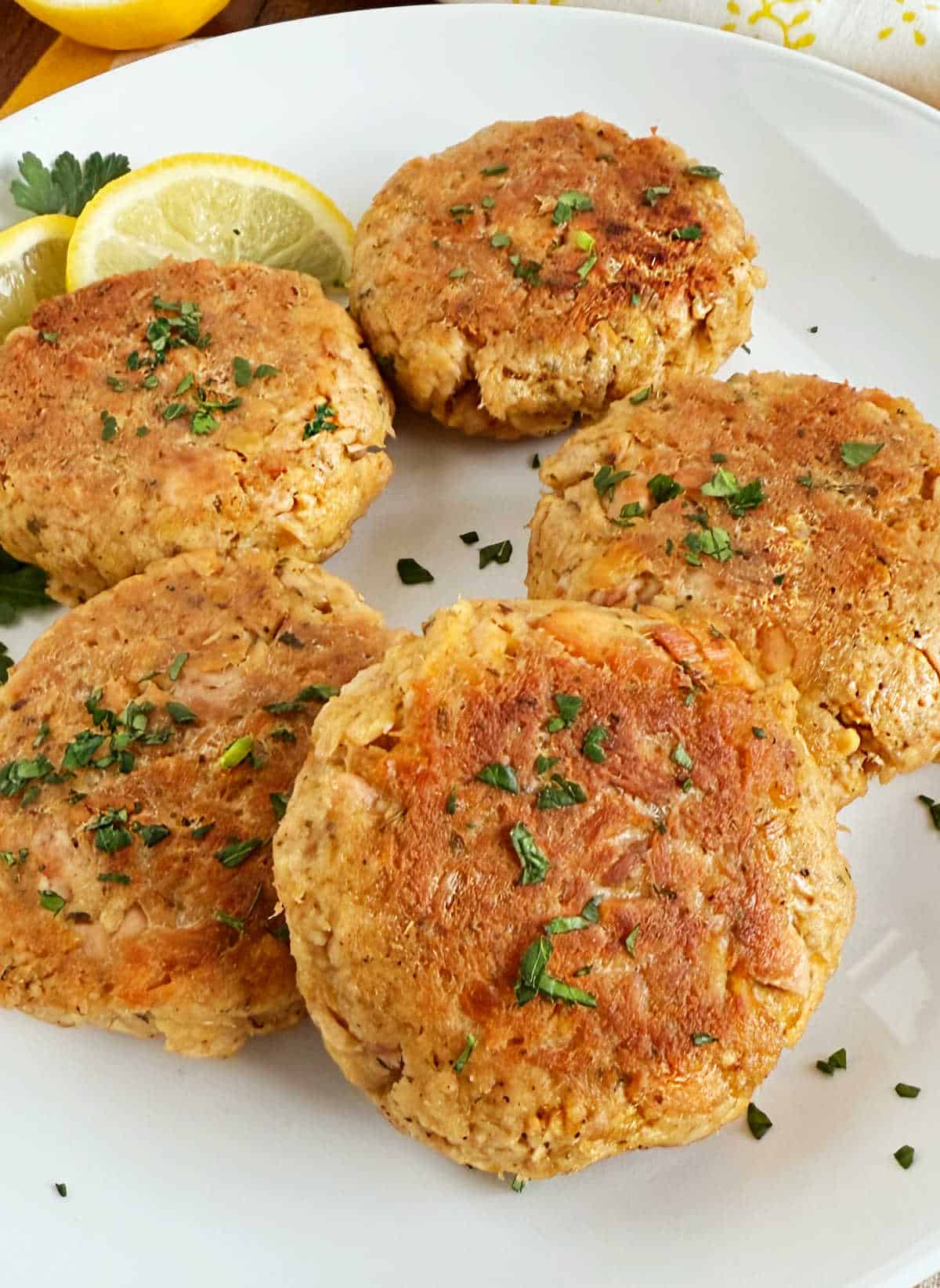 golden brown tuna patties on a plate.