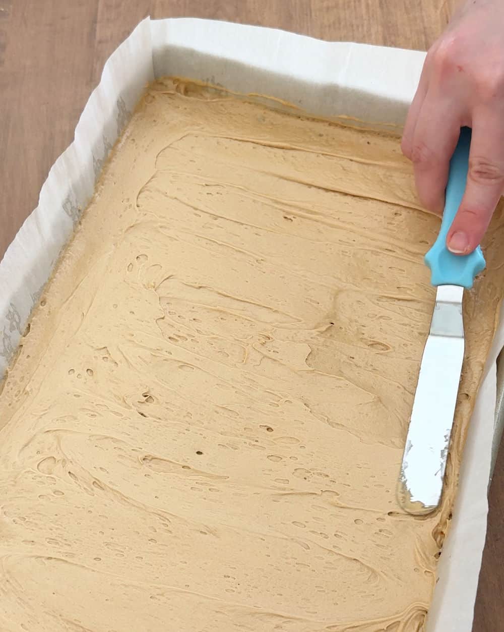 spread frosting with offset spatula.