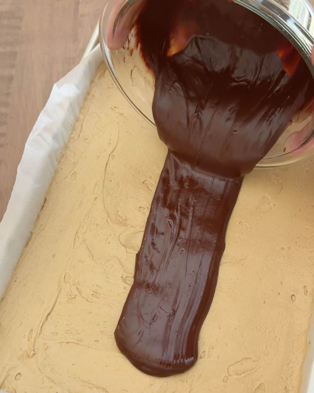 pour ganache over buttercream layer.