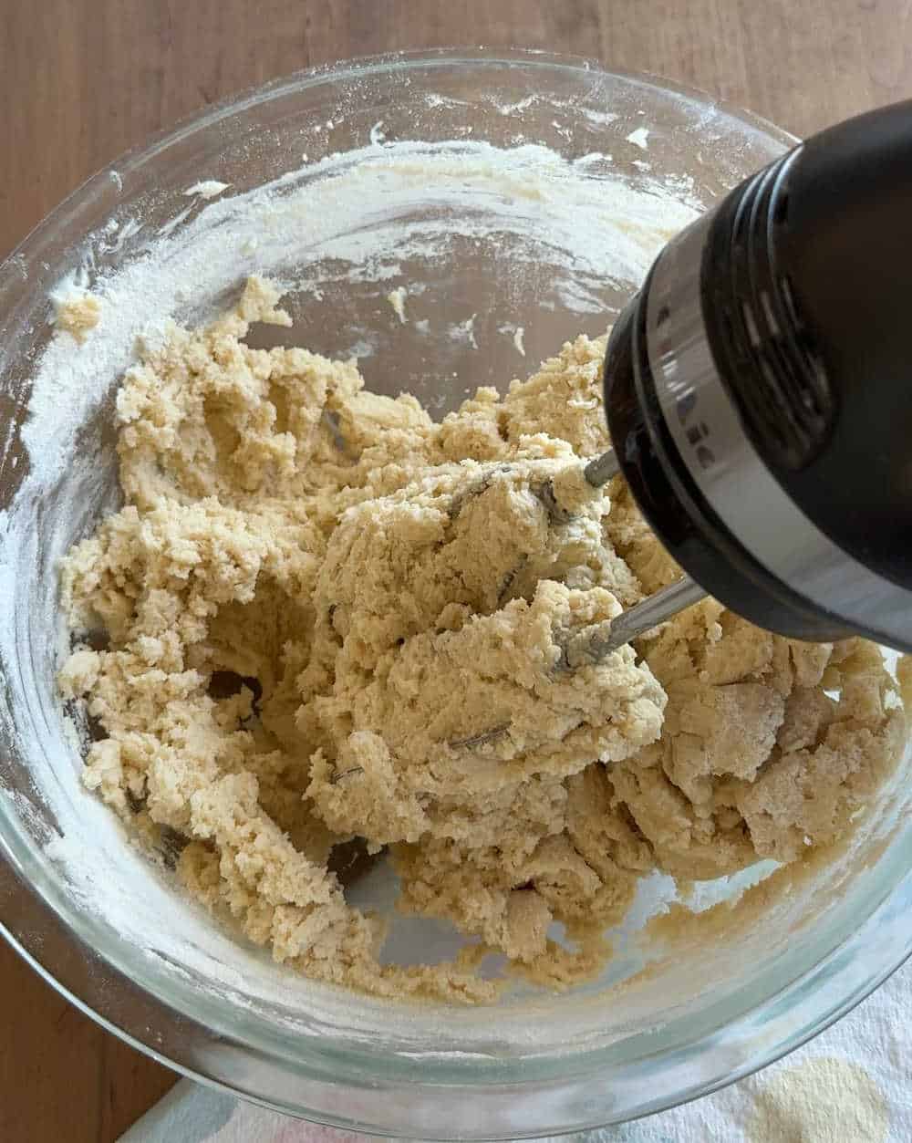 dry ingredients with electric mixer in bowl.