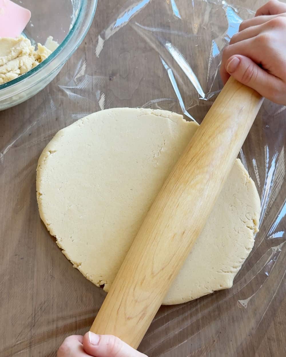 roll dough over plastic wrap.