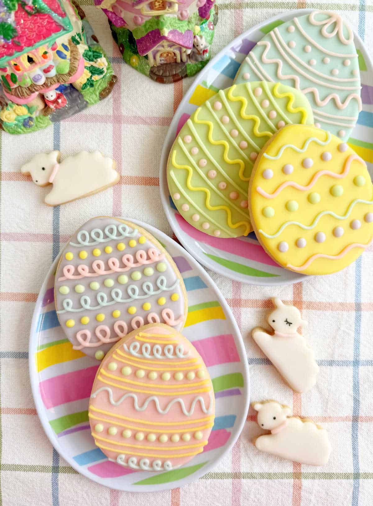 decorated Easter cookies in egg shapes and lamb shapes.